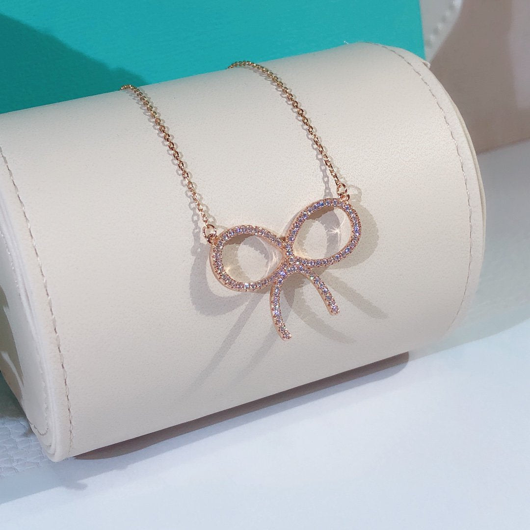 [Glow Muse ]CLAW SET RHODIUM PLATED BOW NECKLACE
