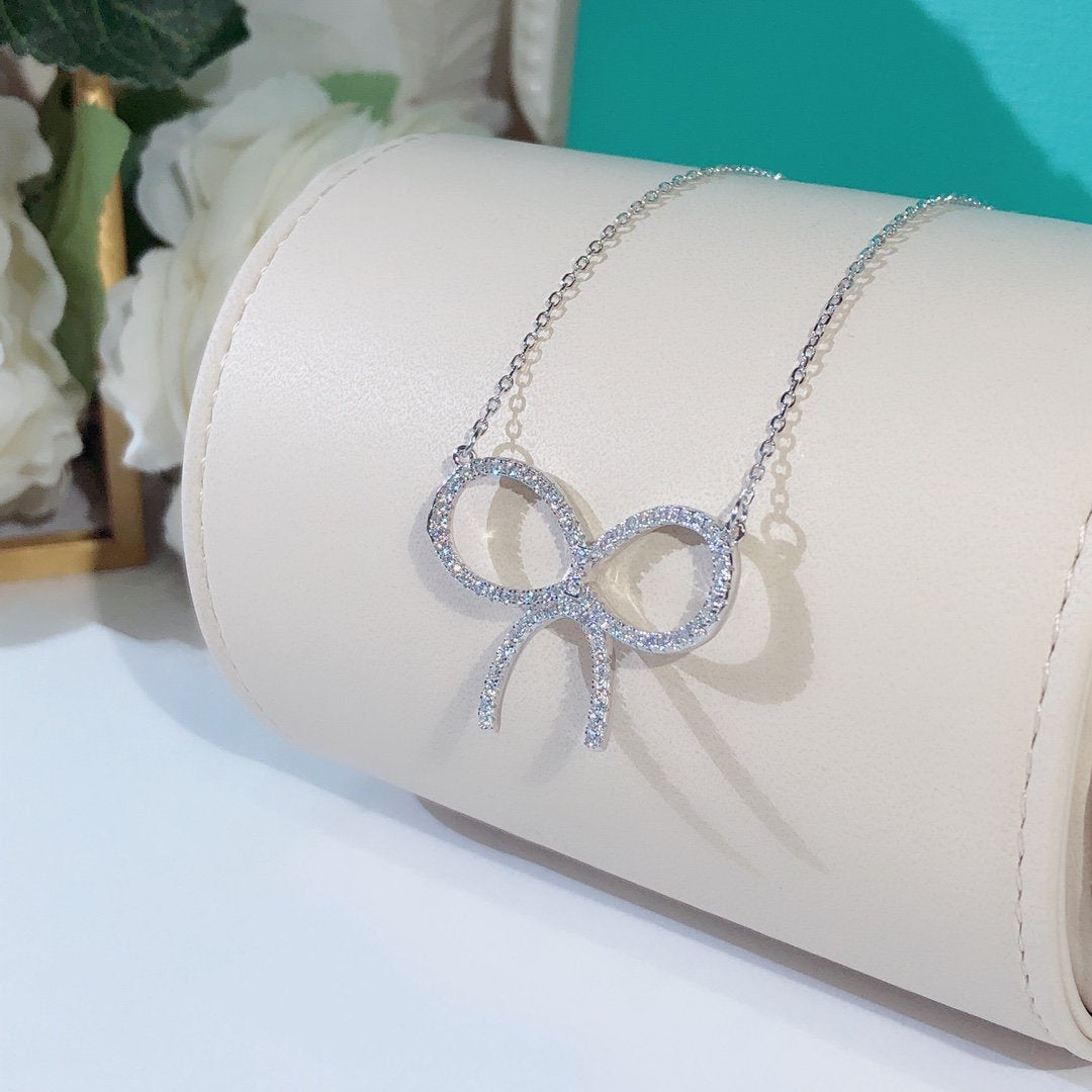 [Glow Muse ]CLAW SET RHODIUM PLATED BOW NECKLACE